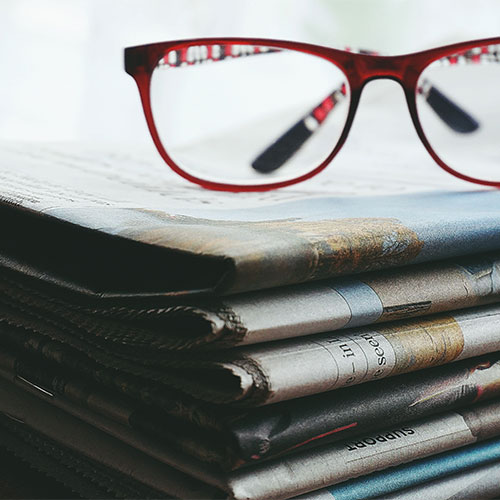 glasses with newspaper