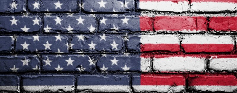 American flag painted on a brick wall
