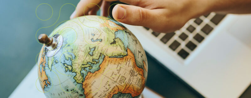 hand on globe