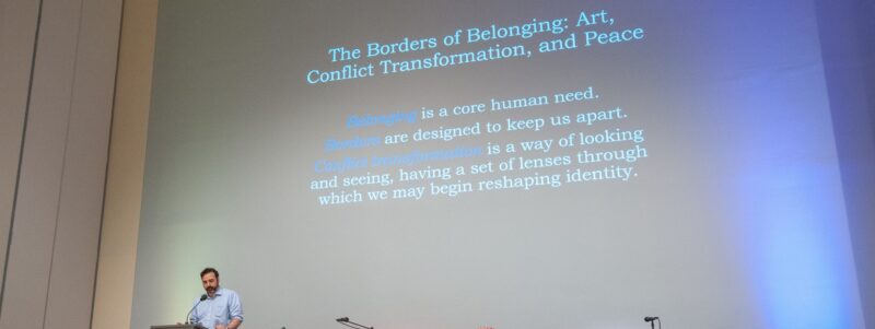 Peter Bonfitto introducing a symposium on the Borders of Belonging: Art, Conflict Transformation, and Peace
