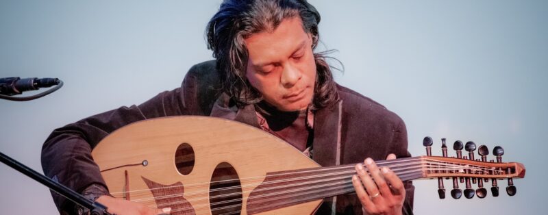 Oliver Rajamani playing a unique guitar.