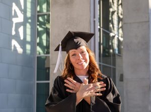 Austin Community College graduate poses